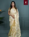 Cream Muslin Embroidery Saree